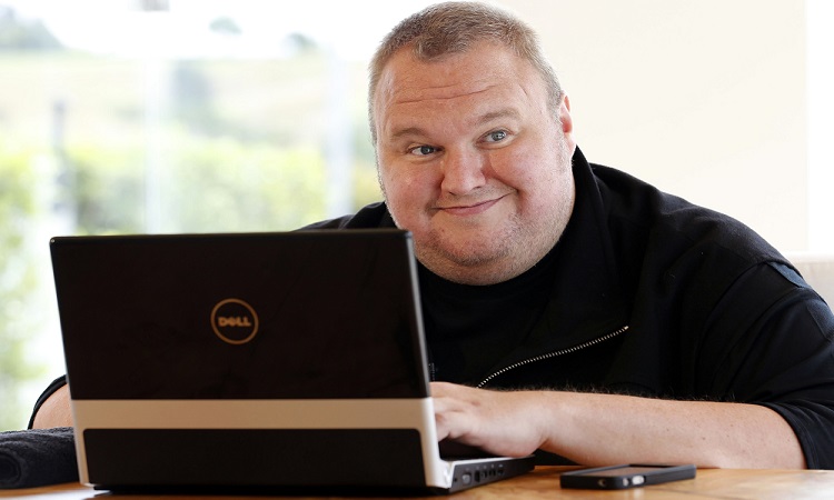 Kim Dotcom smiles during an interview with Reuters in Auckland